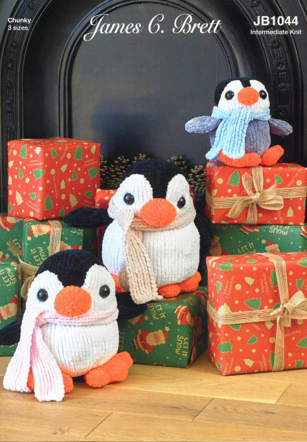 Toy Chrismtas Black and White Mum and Dad Penguins in 2 sizes with different coloured scarves, with orange beak and feet plus Grey, White a Black Baby penguin with blue scarf.